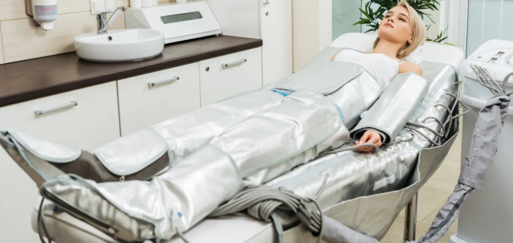 Patient wearing a pressotherapy compression suit for lymphatic drainage